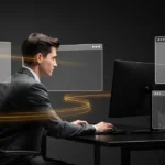 Man in business suit sitting at desk with multiple transparent browser windows and golden light trails around him.